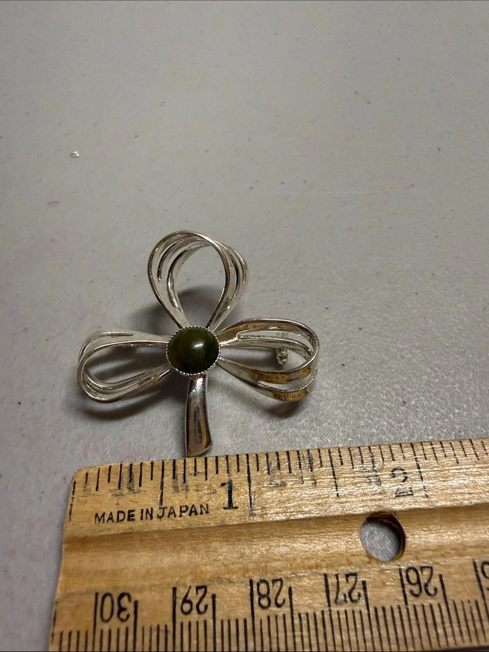 Silver Bow Brooch with Olive Green Center